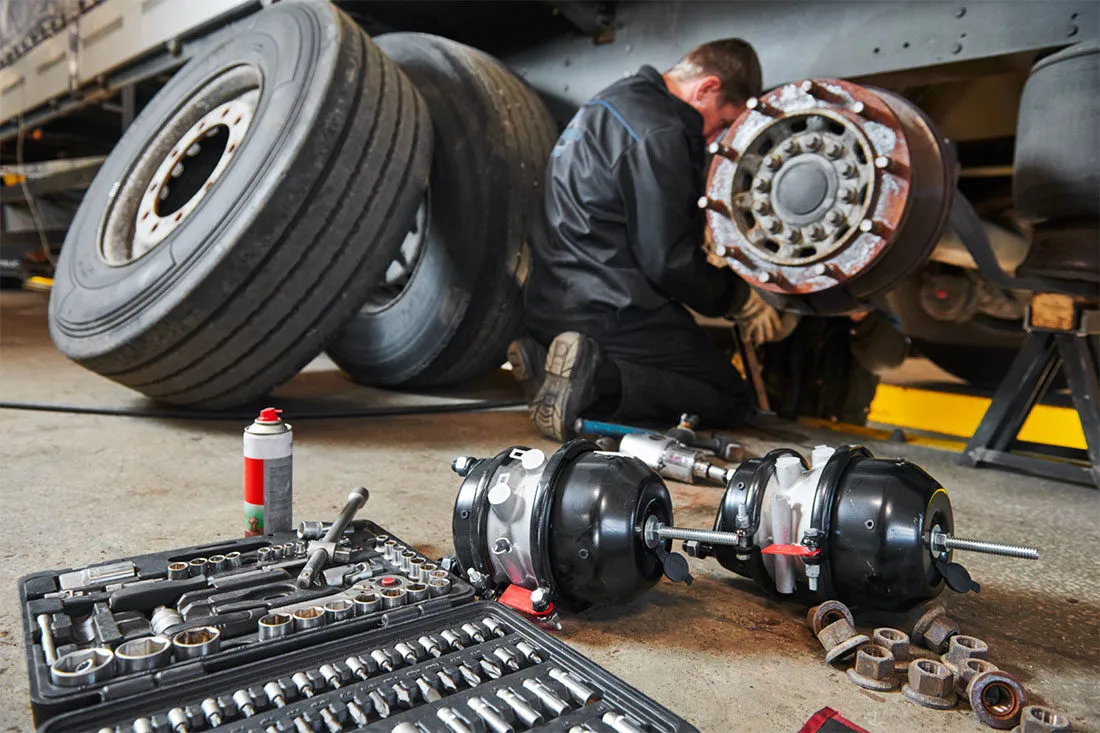 man fixing a truck