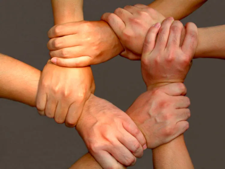 five hands in a circle